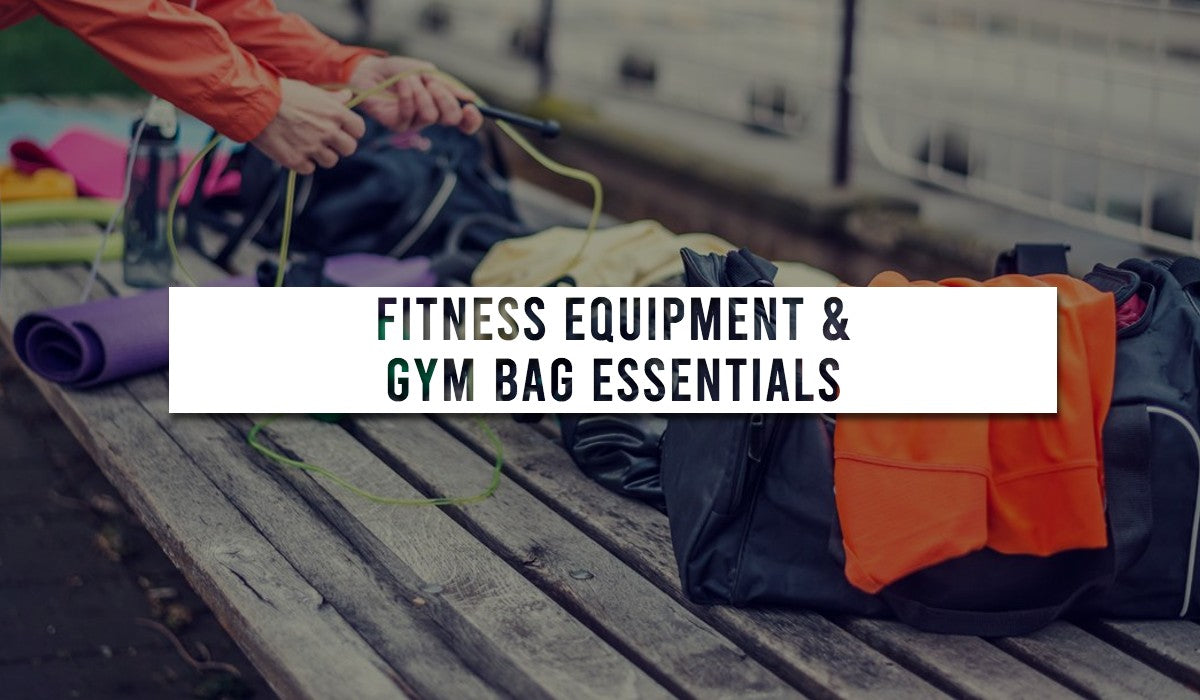 a display of gym products and accessories being organised in to a gym bag.