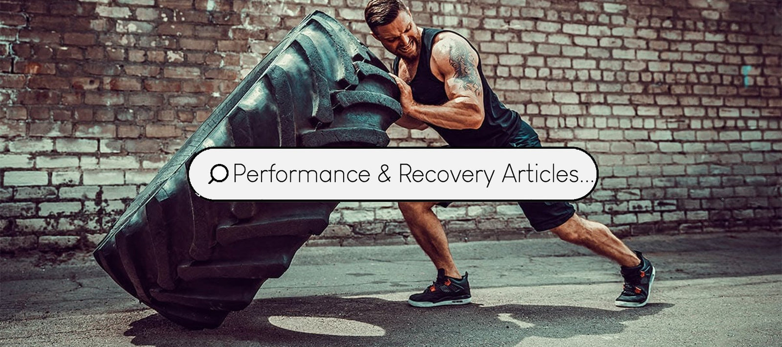 a string male fitness athlete performing tyre flips as a cardio training session.