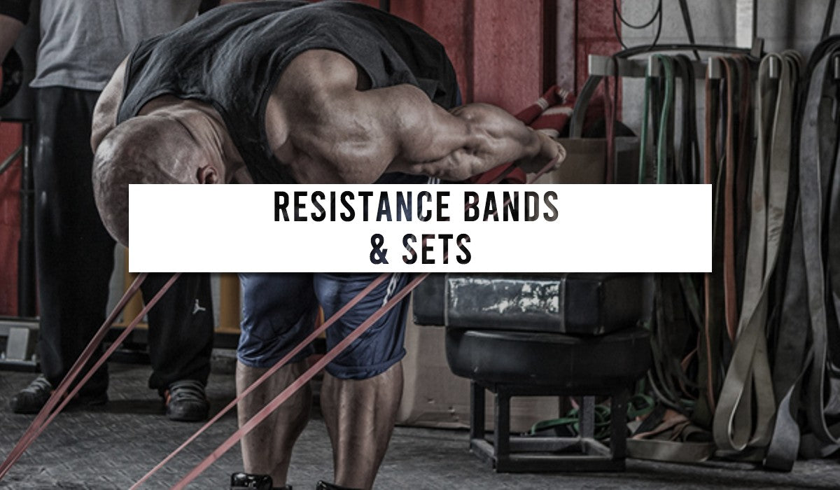 a male bodybuilder bent over doing resistance band tricep extensions.